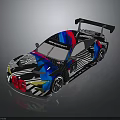 Sleek Race Car With Colorful Geometric Livery And Rear Wing Design