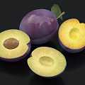 Fresh Ripe Purple Plums Whole and Sliced with Yellow Flesh and Seed