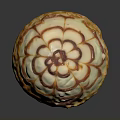 Round Dessert With Creamy White Frosting And Caramel Floral Pattern On Almond Crumb Base