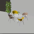 Modern Round Table And Chairs Set With Yellow Pink Seats Potted Plant On Wooden Floor