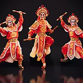 Three Performers In Traditional Red Chinese Opera Costumes With Ornate Headgear And Sticks