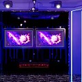 Modern KTV Interior Design With Purple Lighting Large Screens And Comfortable Sofas 3d model