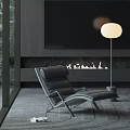 Modern Black Leather Lounge Chair in Stylish Interior with Fireplace Floor Lamp and Large Windows