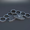 Metal Brass Knuckles With Decorative Skull Pattern And Multiple Finger Holes