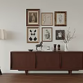 Modern Brown Wooden Entryway Cabinet Sideboard With Decorative Items Floor Lamp And Framed Wall Artworks
