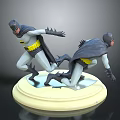 Two Dynamic Posed Batman Action Figurines On Light Colored Display Base
