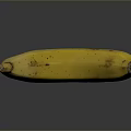 Ripe Yellow Banana With Brown Spots On Smooth Reflective Surface