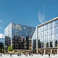 Modern Office Building With Glass Facade Urban Square Pedestrians And Blue Sky