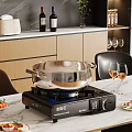 Modern Kitchen Interior With Gas Stove Stainless Steel Pot Marble Countertop And Wine Glasses