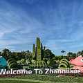 Cute Cartoon Sculptures In Zhangjiajie With Green Topiary And Blue Sky