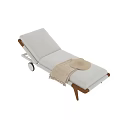 Stylish Sofa Bench Featuring White Cushion Wooden Armrest Wheels And Straw Hat Blanket