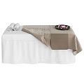 Comfortable Massage Bed With Soft Blanket Cozy Towels And Decorative Tray Of Pink Flowers
