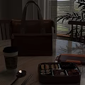 Orange Leather Lunch Bag With Starbucks Coffee Cup And Bento Box On Table