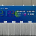 Indoor Event Venue With Stage Arranged Seats And Large Screen