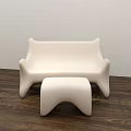 Modern Public Chair Featuring White Sleek Surface And Pink Patterned Accents With Matching Ottoman
