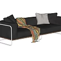 Black Leather Two Seater Sofa With Colorful Blanket Pillows And Metal Frame