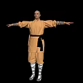 Man In Yellow Martial Arts Uniform With Arms Outstretched On Black Background