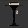 Round Wooden Table With Orange Top Black Metal Leg And White Appliance
