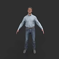 Man in Light Blue Shirt and Jeans Standing Against Dark Background