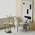 White Plush Single Sofa With Throw Blanket And Side Table Near Abstract Wall Art