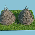 Two Thatched Huts With Conical Straw Roofs On Green Grassy Area