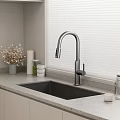Contemporary Kitchen Sink Featuring Sleek Faucet And Window Blinds On Countertop