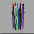 Vibrant Colored Pencils Arranged In Transparent Glass Cup On White Surface
