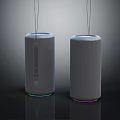 White Cylindrical Speakers With Colorful Base Ring Lights And Hanging Top Cables