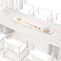 Wooden Tea Table and Chairs with Tea Tray Teapot Cups in Bright Natural Light