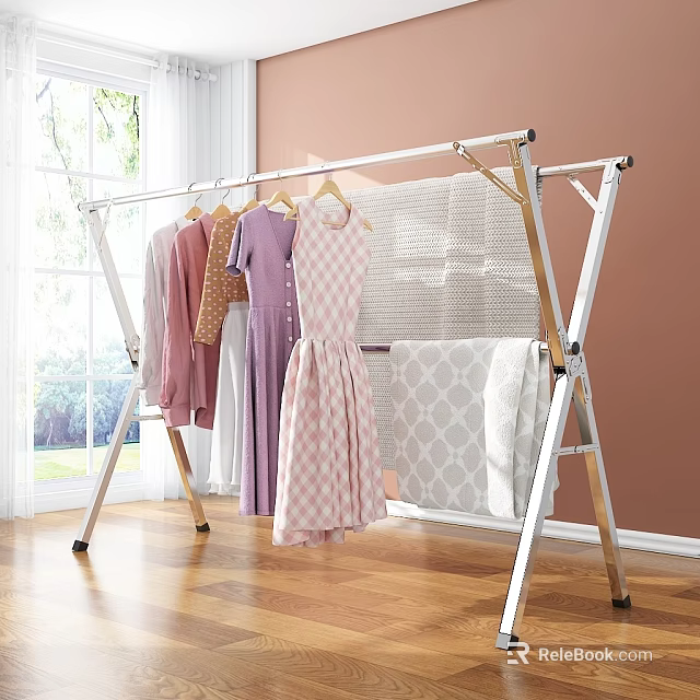 Clothes Hanging On Aluminum Clothes Rack With Dresses Tops And Patterned Blanket 3d model 