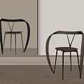 Modern Leisure Chairs With Curved Metal Frame And Minimalist Design In Light Room
