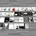 Various Books And Magazines Displayed On Wooden Floor With Different Covers