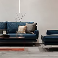 Modern Living Room Interior With Blue Sofa Coffee Table Bookshelves Staircase And Wall Art