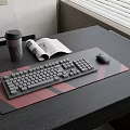 Modern Dark Desk Setup With Keyboard Mouse Pad Coffee Cup And Magazine