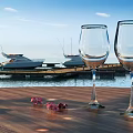 Picturesque Marina Scene With Moored Yachts Calm Water Wooden Table Wine Glasses And Pink Petals