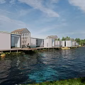 Modern Boutique Guesthouse Architecture With Large Glass Windows Wooden Deck And Green Lawn