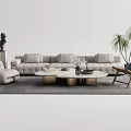 Modern Gray Sofa with Multiple Cushions and Round Coffee Tables with Metal Bases and Ottoman