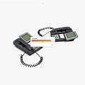 Two Black Landline Telephones With Display Screens Keypads And Coiled Cords