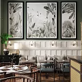 Elegant Restaurant with Large Black and White Botanical Paintings Green Walls White Wainscoting Rattan Furniture
