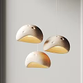Modern Three White Hemisphere Textured Pendant Lights with Warm Glow 3d model