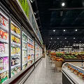 Well Lit Supermarket Department Store With Spacious Aisles And Stocked Grocery Shelves