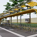 Yellow Bicycle Shelter With Parked Bicycles Trees And Green Path Area