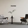 Poliform Living Room Setup With Two Patterned Armchairs Small Round Table And Potted Plant 3d model