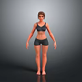 Woman in Black Sports Bra and Shorts Standing Against Grey Background