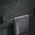 Black Bathroom Towel Rack Mounted On Dark Marble Textured Wall With Gray Towel