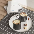Two Black Coffee Mugs With Frothy Coffee On White Tray And Hazelnuts Near Books