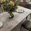 Modern Dining Table Set With Six Grey Chairs Floral Centerpiece And Fireplace