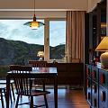 Cozy Living And Dining Room Interior With Colorful Striped Sofas Large Windows And Sea View