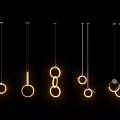 Modern Pendant Lights With Different Ring Designs And Warm Glow On Black Background