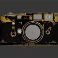 Vintage Digital Camera Retro Design With Gold Accents Dark Body Round Lens And Control Buttons
